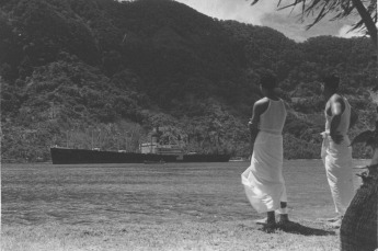 Samoan Men Watching Freighter. 1940. Photo credit/copyright.