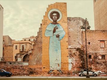 Mural of San Benedetto in Palermo, Italy